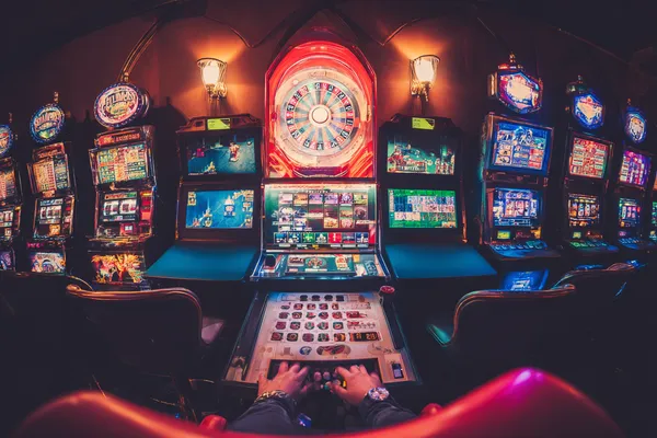 A close-up shot of golden coins falling around a spinning roulette wheel, representing immersive casino action at BD9.